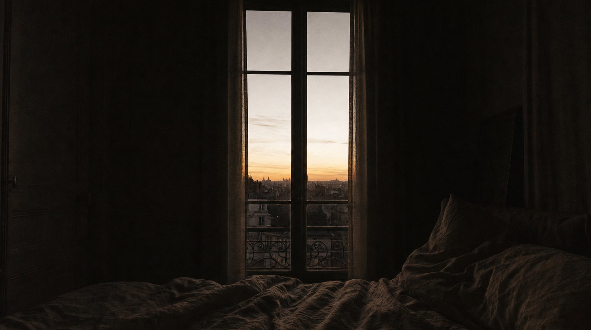 A dim interior before sunrise, with the first light appearing at the window.